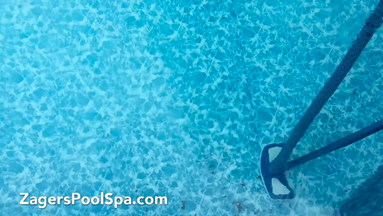 Vacuuming a Doughboy Above Ground Pool