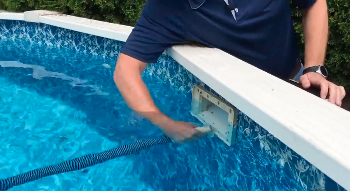 Attach Adapter to Skimmer – How to Vacuum a Doughboy Above Ground Pool